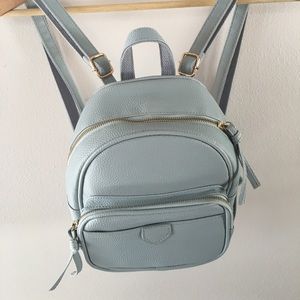 Mini blue backpack with gold zipper